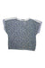 The Prana Womens Casual Short Sleeve Top features a blue background with small floral print, white trim on the shoulders and neckline, an elasticized hem, and a relaxed fit for lightweight comfort.