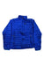 The Women’s Ultralight Down Jacket features a bright blue design with a high collar, zip front, and three zippered pockets—two at the waist and one on the chest. The jacket is shown laid flat on a white background.