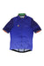 The Rapha Super Light Weight Country Jersey is a short-sleeve blue cycling top with a front zipper, subtle geometric sleeve patterns, a multicolored chest stripe patch, green inner collar, and faint Rapha logo in a breathable design.