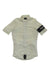The Rapha Souplesse Jersey II is a short-sleeved, light beige cycling jersey with a front zipper and black left sleeve armband featuring the white Rapha logo. It’s lightweight, breathable, and designed for high-performance cycling.