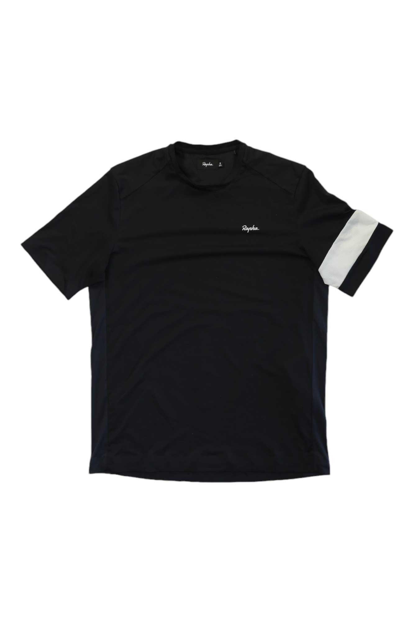 The Technical T-Shirt is a black men's short-sleeve tee with a white diagonal stripe on the left sleeve and a small white Rapha logo on the left chest—offering style and comfort for any adventure.