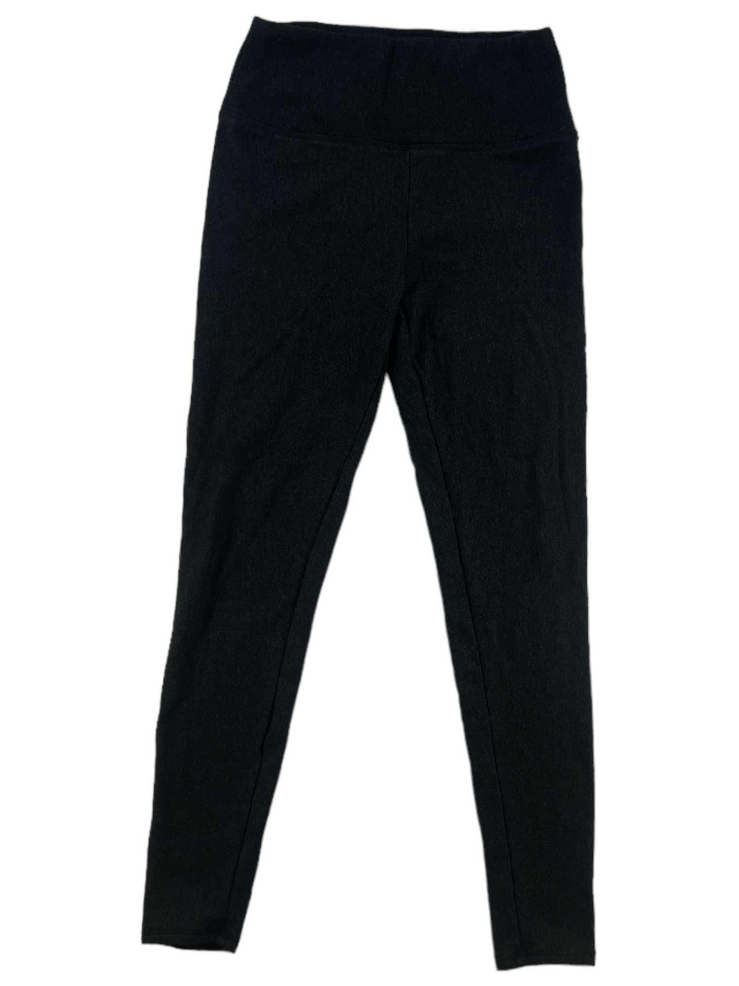 Journey Ponte Fitted Leggings in black, high-waisted and fitted, are laid flat on a white background with the waistband slightly folded outward and both legs extended straight.