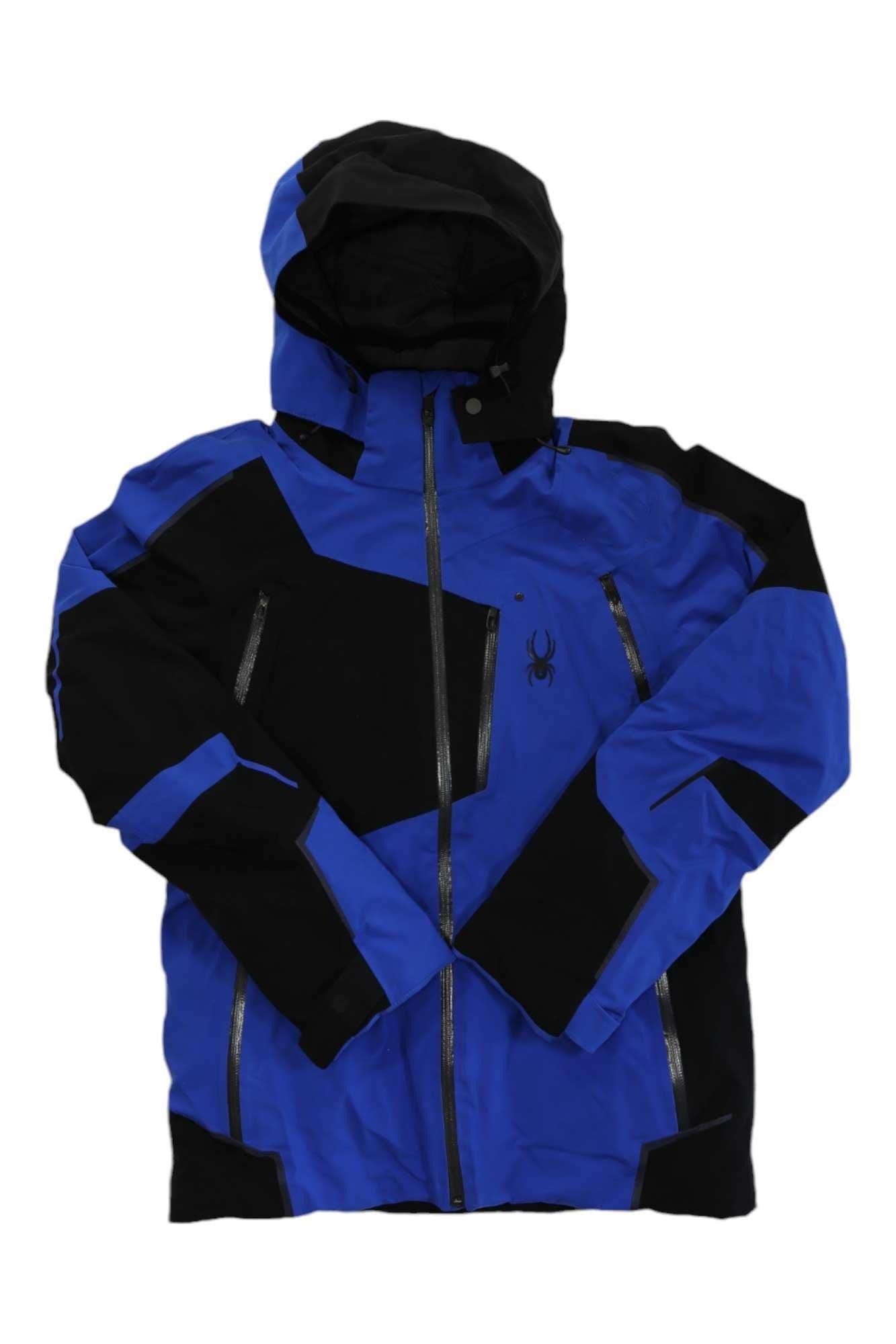 The Spyder Men’s Leader Jacket is a blue and black ski jacket with zippered pockets, front zipper, angular color-block design, small spider logo on the chest, waterproof fabric, and PrimaLoft Silver Eco insulation for warmth.