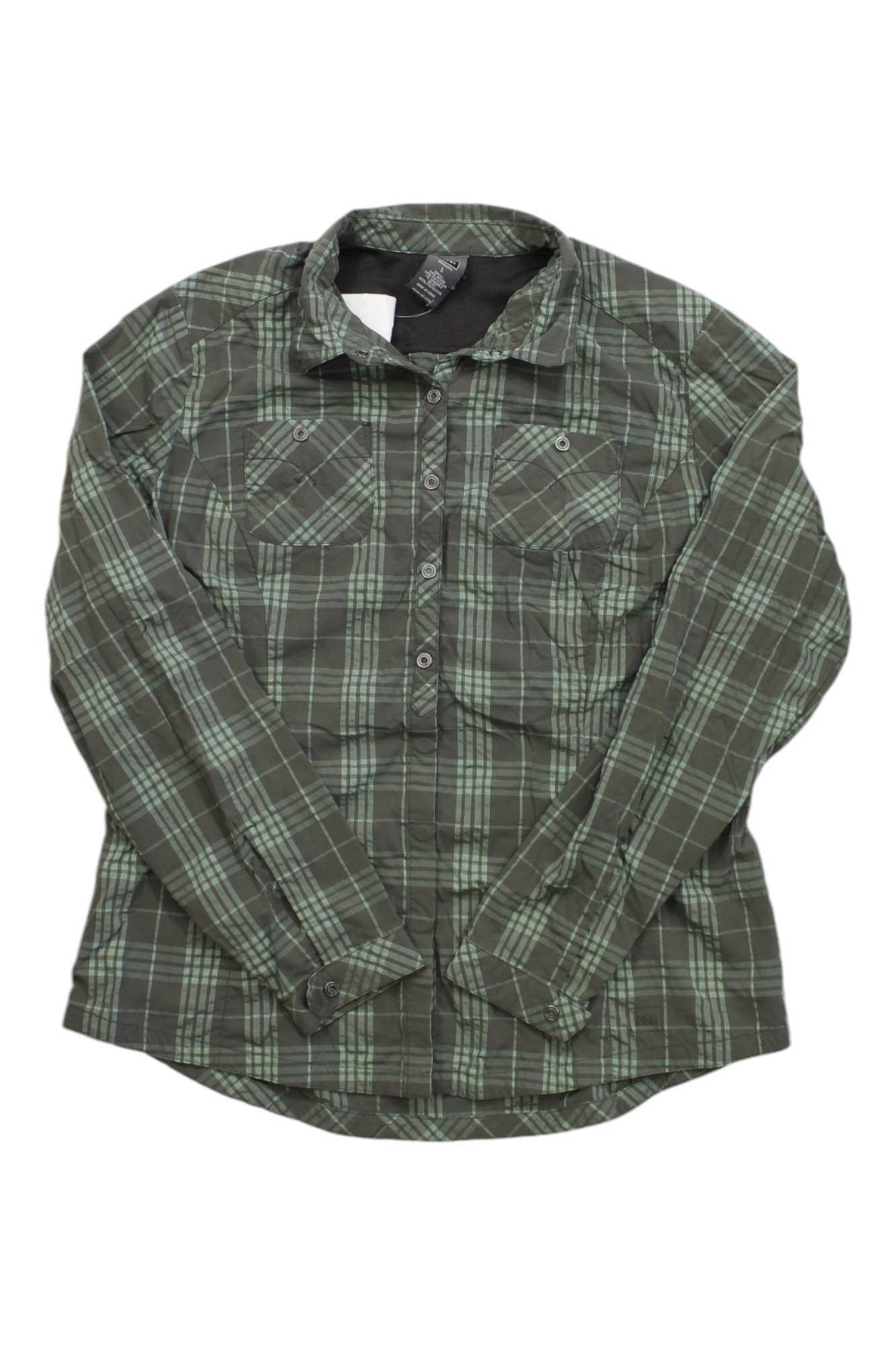 The REI Co-op Rendezvous Plaid Shirt for women is a green and black plaid button-up hiking shirt with long sleeves, two chest pockets, UPF 50+ sun protection, and is shown laid flat on a white background.