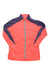 The Salomon Womens Windbreaker Shell Jacket features a bright coral color, long sleeves, navy panels on the shoulders and arms, and a light blue zipper. This lightweight, breathable jacket is ideal for active days.