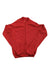 A red Rapha Mens Long Sleeve Core Jersey with a full front zipper is laid flat on a white background. This moisture-wicking cycling jersey features a subtle chest logo and a streamlined, simple design.