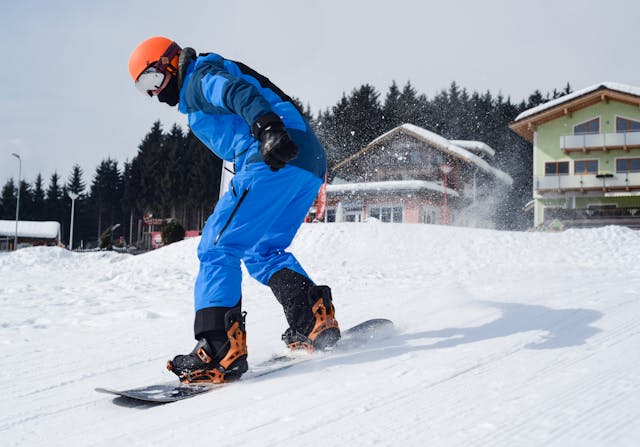 A snowboarder snowboarding