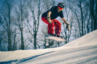 A snowboarder mid-air