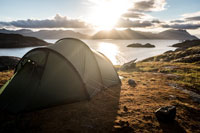 tent with sunset in the background