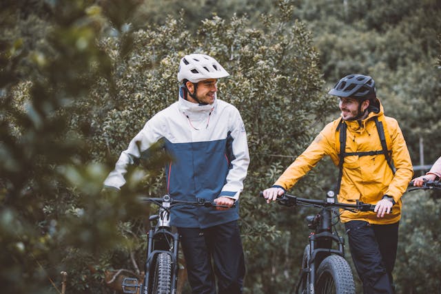 two men with bicycles