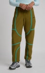 Tectonic pants in olive with black side stripes and white logo accents, full-length