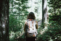 woman wearing a backpack while hiking