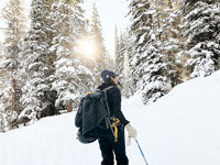 a woman wearing gloves in snow