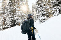 a woman wearing gloves in snow