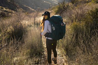 A woman hiking a trail