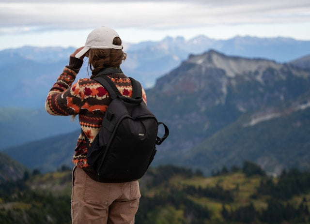 A woman standing on a mountain