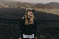 A woman standing in the wilderness