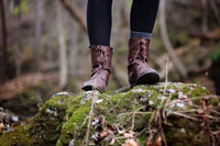 A woman wearing women’s outdoor boots