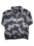 The Tribal Print Half Zip Fleece Pullover by The North Face features black and gray geometric zigzag patterns on long sleeves, shown laid flat on a white background.