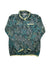 The Women's Mountain Side Pullover Jacket is a long-sleeve, green fleece with a leafy green and blue pattern and light yellow trim on the collar, cuffs, and hem.