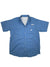 The Mens PFG Bahama Short Sleeve Shirt in blue features multiple front pockets, including flap and zippered styles. Made with quick-dry fabric and UPF 50 protection, it offers outdoor comfort. Displayed flat on a white background.