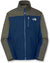 The Kids' Apex Bionic Soft-Shell Jacket features olive green sleeves and shoulders, a navy blue body, windproof fabric, front zipper, two side pockets, chest pocket, and The North Face logo on the left chest.