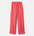 Kids' Cypress Brook II Rain Pants in coral pink feature a straight-leg cut, elastic waistband, and side cargo pocket—ideal for trail adventures—shown on a plain white background.