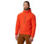 A man wears the Men's Kor Strata Hooded Jacket—breathable, with stretch insulation and a chest pocket—paired with brown pants, standing sideways against a plain white background.