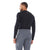 A man, seen from behind against a white background, is wearing a long-sleeve black shirt and the Men's Scree Pants—versatile softshell pants designed for alpine climbs.